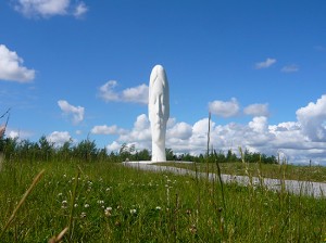 20m high sculpture of a girl's head against a blue sky