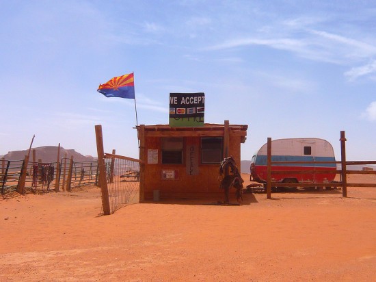 wodden shack displaying a large sign 'we accept'