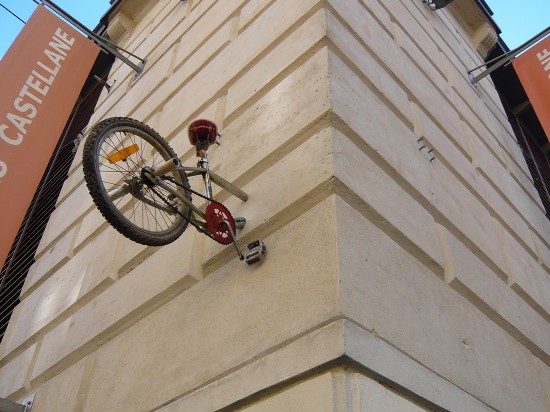 Half bike breaking through walls in the city centre (demi vélos fixées sur les murs de l'Ecusson)
