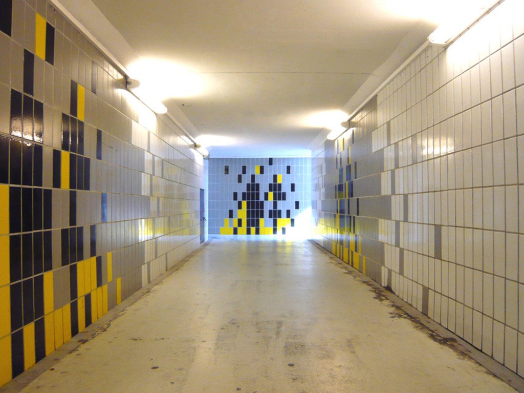 underground passage tiled and lit with flourescent lights