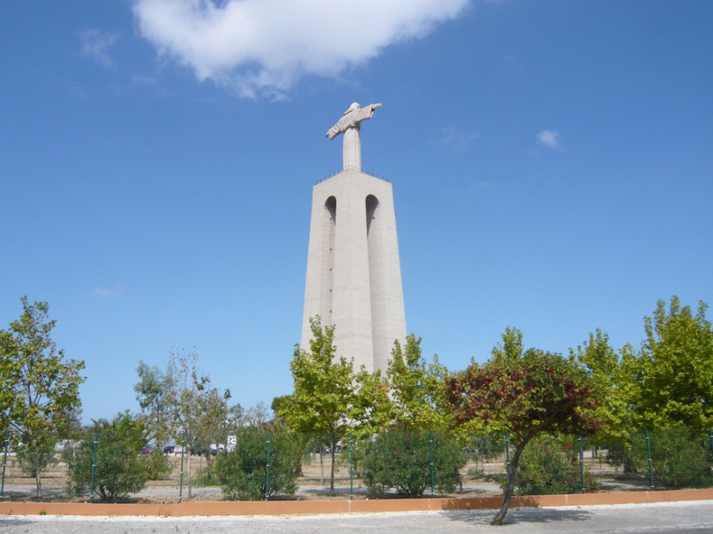 monument of Christ the King seen across an empty car park