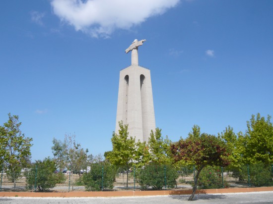 monument of Christ the King seen across an empty car park